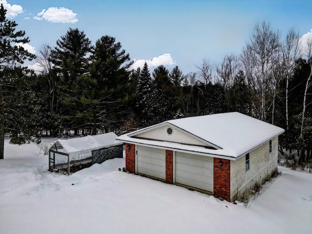 view of snow covered garage