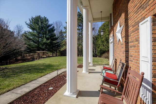view of patio featuring a porch