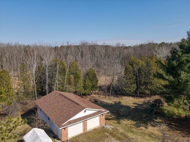 aerial view featuring a view of trees