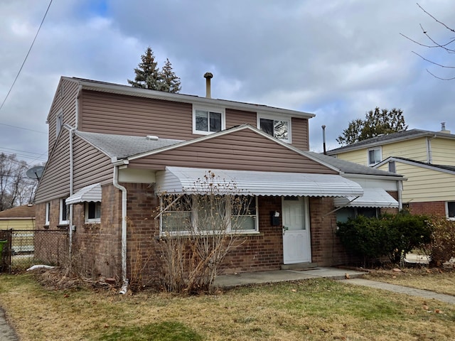 view of front of house with a front lawn