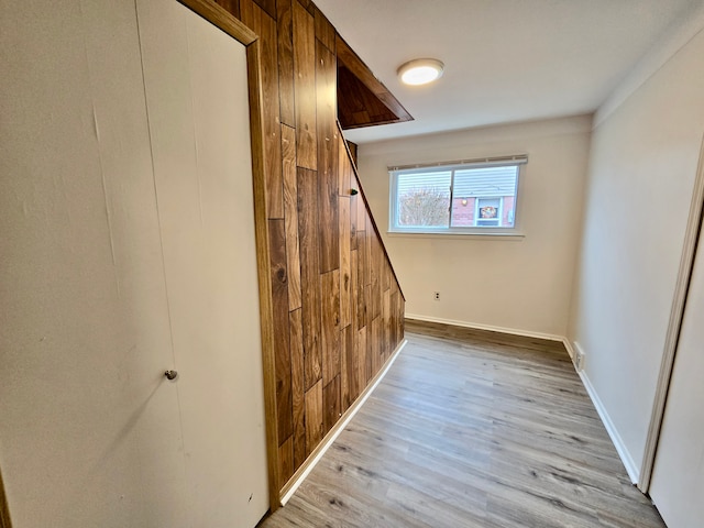 bonus room with light hardwood / wood-style flooring