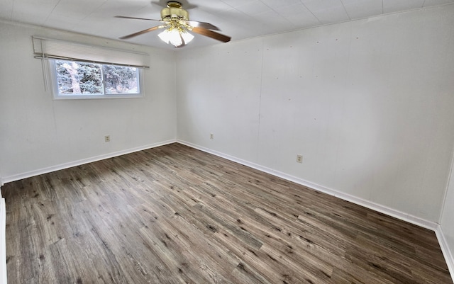 spare room featuring wood-type flooring and ceiling fan