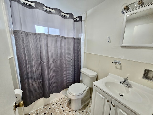 full bathroom with vanity, toilet, tile patterned flooring, and shower / bath combo