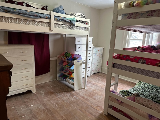 bedroom with wood-type flooring