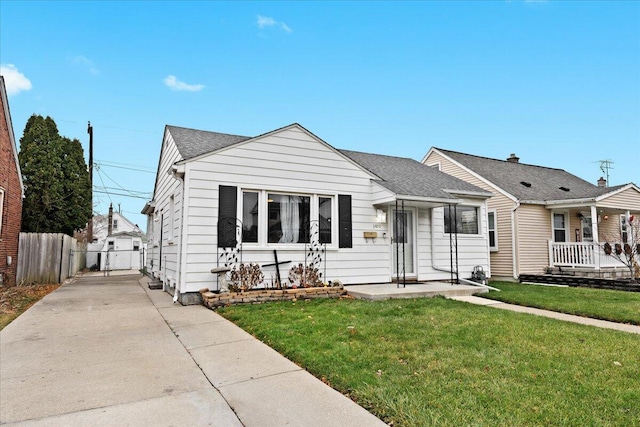 bungalow-style house with a porch and a front lawn