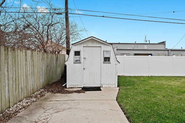 view of outdoor structure featuring a lawn