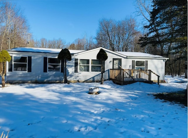 view of front of property with a wooden deck