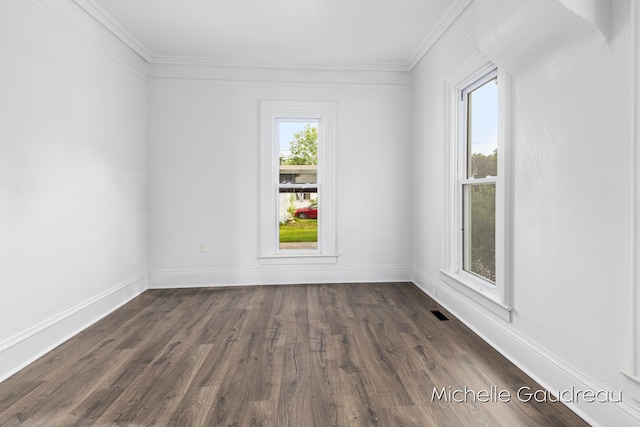 unfurnished room featuring crown molding and dark hardwood / wood-style floors