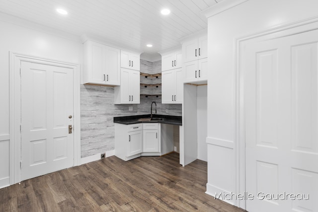 kitchen with sink, wood ceiling, white cabinetry, backsplash, and dark hardwood / wood-style floors