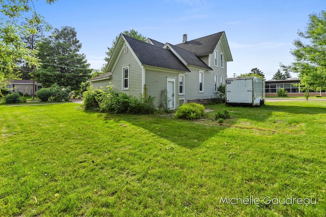 view of home's exterior with a lawn