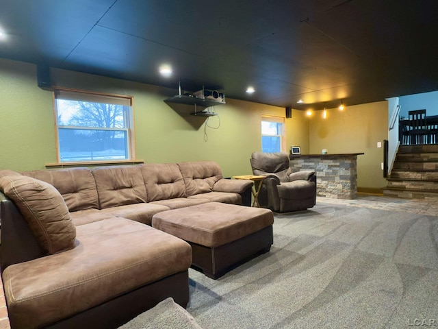 carpeted home theater room featuring plenty of natural light