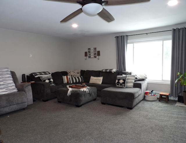 carpeted living room featuring ceiling fan