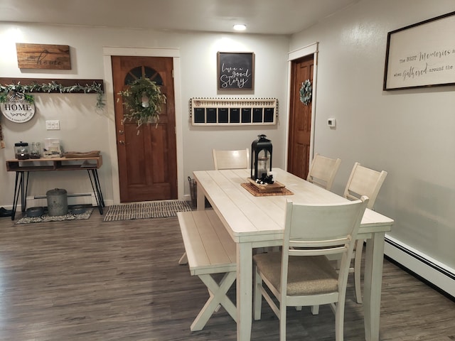 dining room featuring dark hardwood / wood-style flooring and baseboard heating