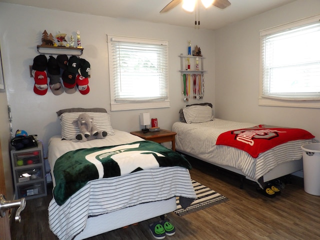 bedroom with dark wood-type flooring