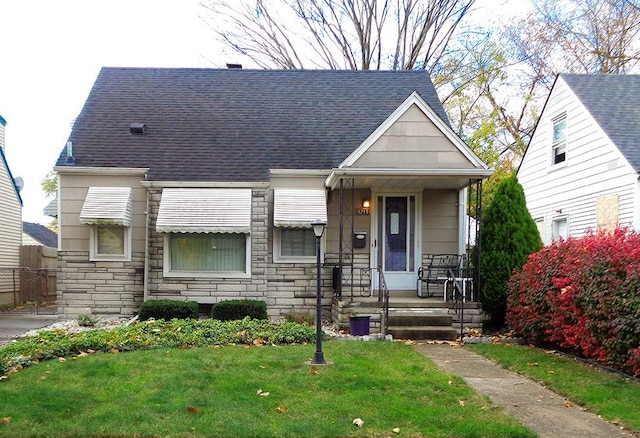 bungalow-style house with a front yard