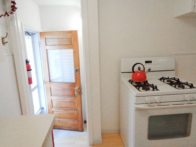 kitchen featuring white gas range oven