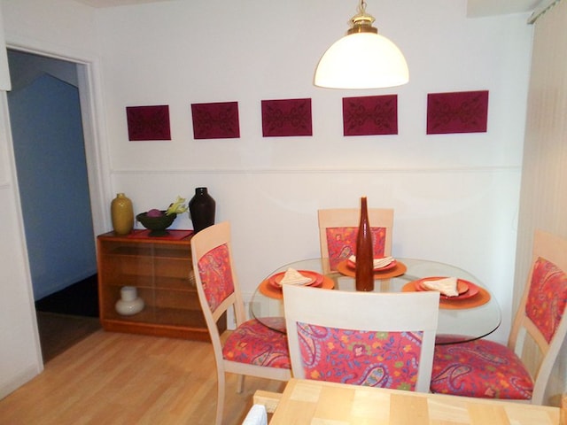 dining area with wood-type flooring