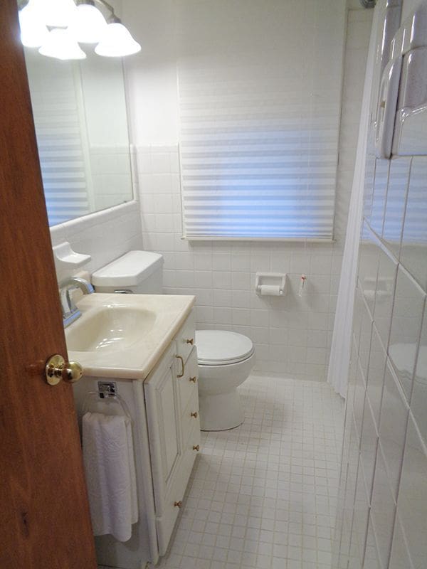 bathroom featuring tile walls, sink, tile patterned floors, and toilet