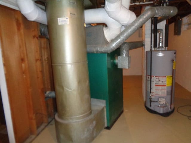 utility room with water heater