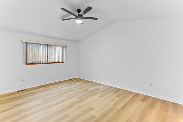 spare room with lofted ceiling, light hardwood / wood-style flooring, and ceiling fan