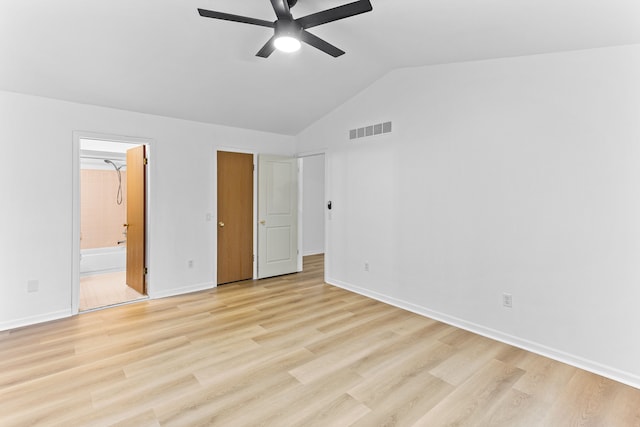 unfurnished bedroom with vaulted ceiling, ceiling fan, ensuite bath, and light hardwood / wood-style flooring