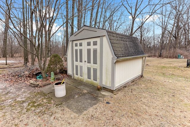 view of outdoor structure with a lawn