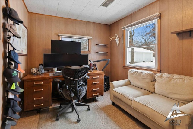 office with carpet and wood walls