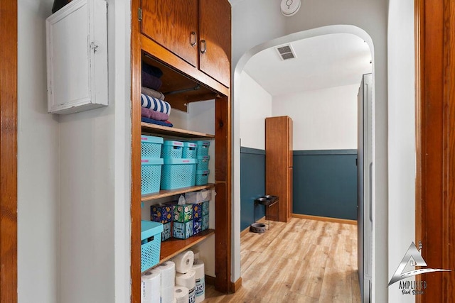 hall with light hardwood / wood-style floors