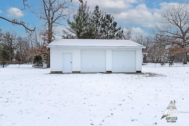 view of snow covered garage