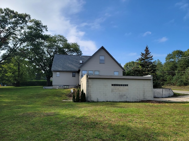 back of property with a lawn