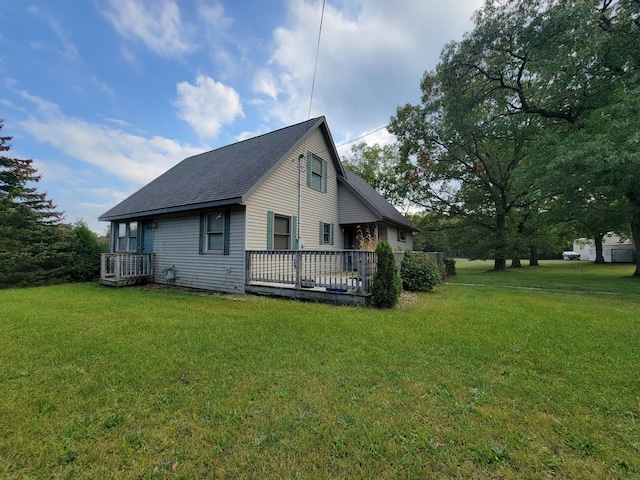 view of property exterior featuring a yard and a deck