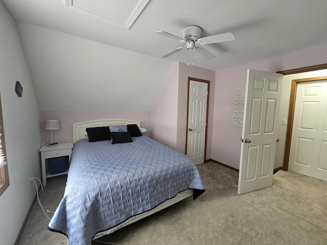 bedroom with lofted ceiling, light carpet, and ceiling fan