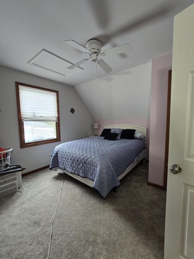 carpeted bedroom with vaulted ceiling and ceiling fan