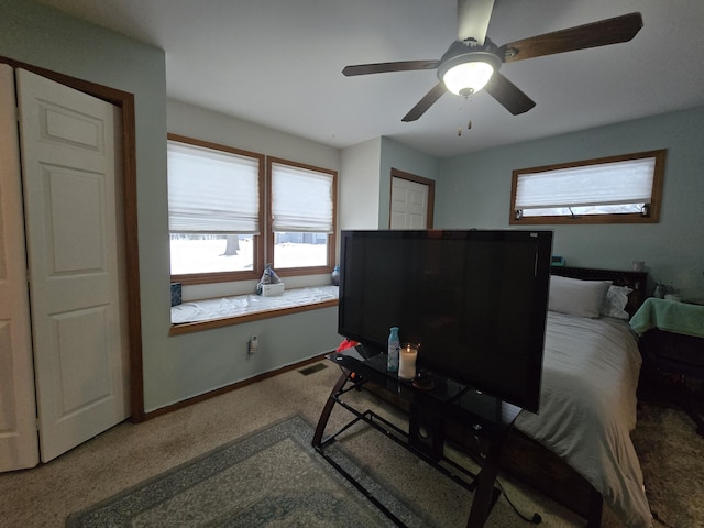 bedroom featuring ceiling fan and carpet flooring