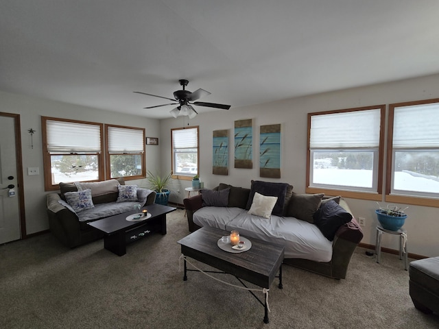 living room with ceiling fan and carpet flooring