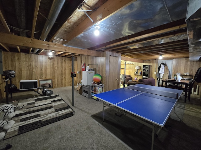 game room featuring carpet flooring and wood walls