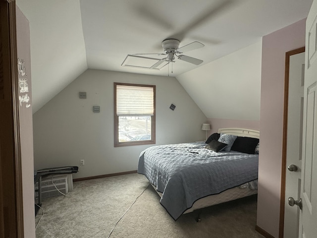 bedroom with light colored carpet, vaulted ceiling, baseboards, and ceiling fan