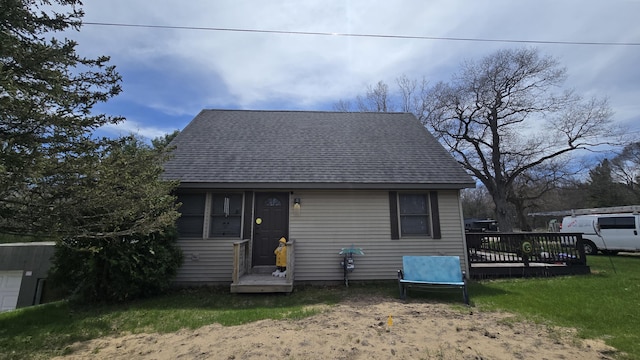 view of front of property with roof with shingles