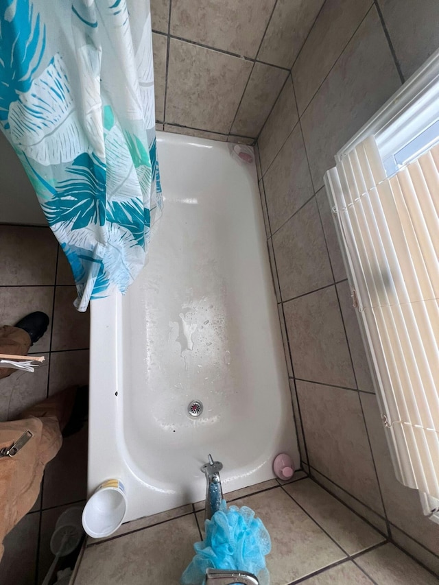 bathroom featuring tile walls and tile patterned floors