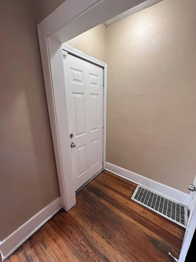 doorway featuring dark hardwood / wood-style floors