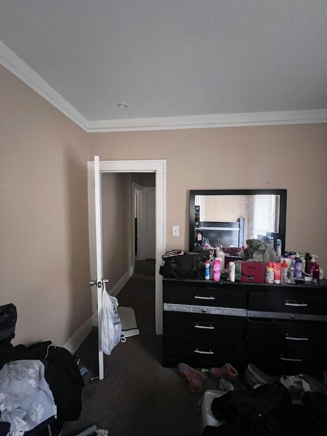 carpeted bedroom featuring crown molding