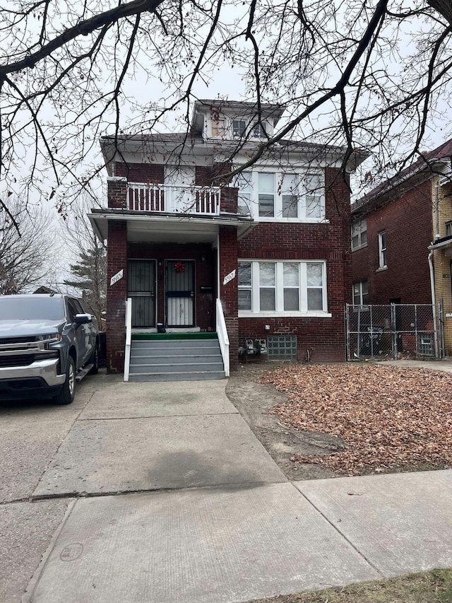 view of front of house featuring a balcony