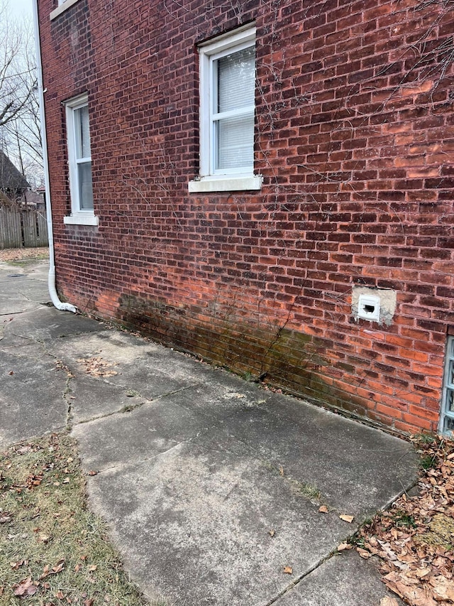 view of side of property with a patio