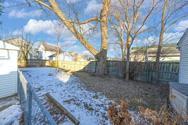 view of yard layered in snow