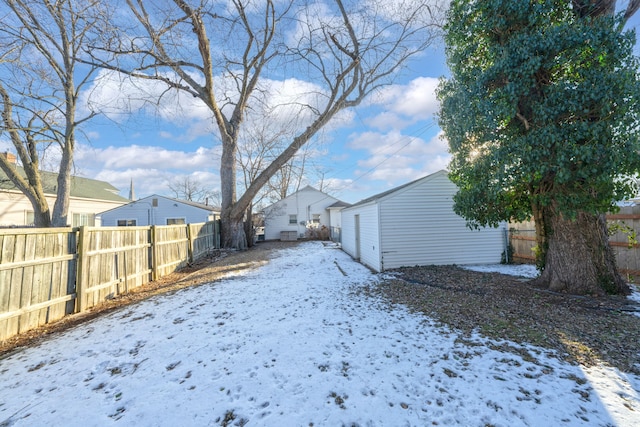 view of yard layered in snow