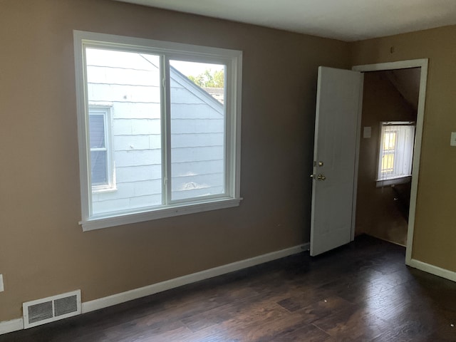 empty room featuring dark hardwood / wood-style floors