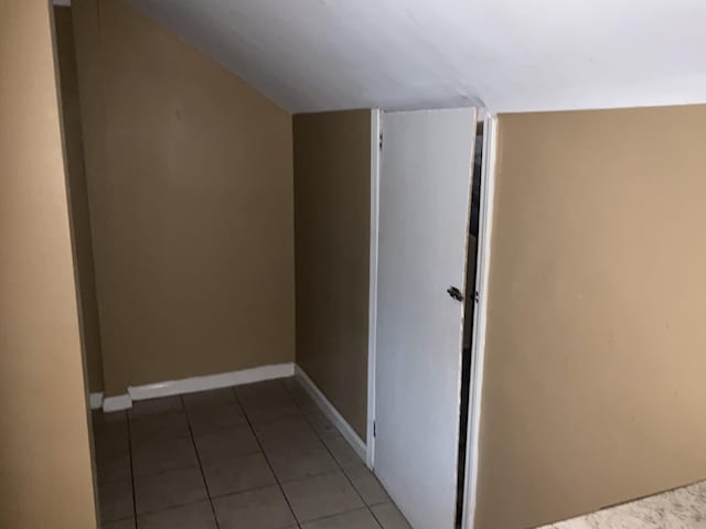 interior space featuring dark tile patterned flooring