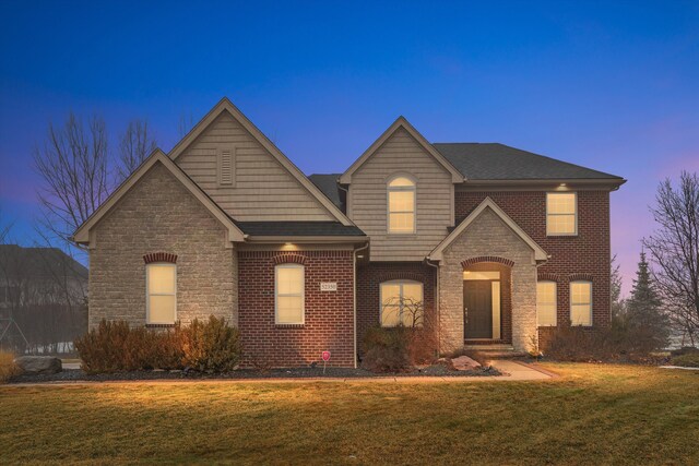 view of front of property with a lawn