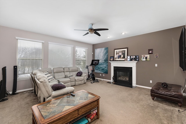 living room featuring carpet flooring and ceiling fan