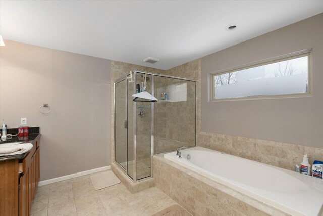 bathroom featuring shower with separate bathtub and vanity